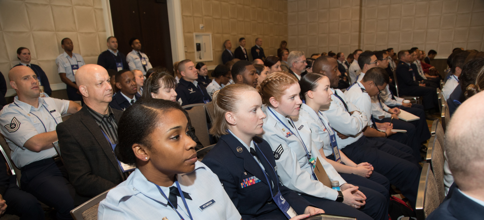 Audience listening to speaker at JFPS